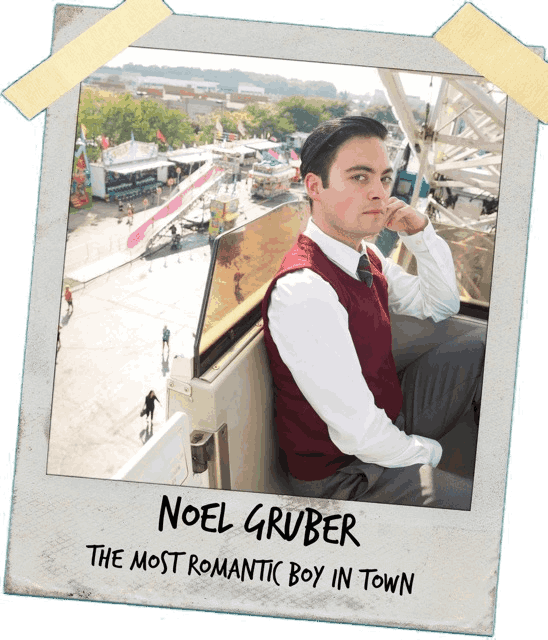 A taped polaroid picture of Noel Gruber on a ferris wheel. The handwritten text on the polaroid reads 'NOEL GRUBER, THE MOST ROMANTIC BOY IN TOWN'